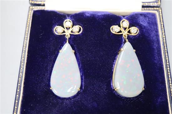 A pair of yellow metal, diamond and pear shaped black opal drop earrings, in fitted box